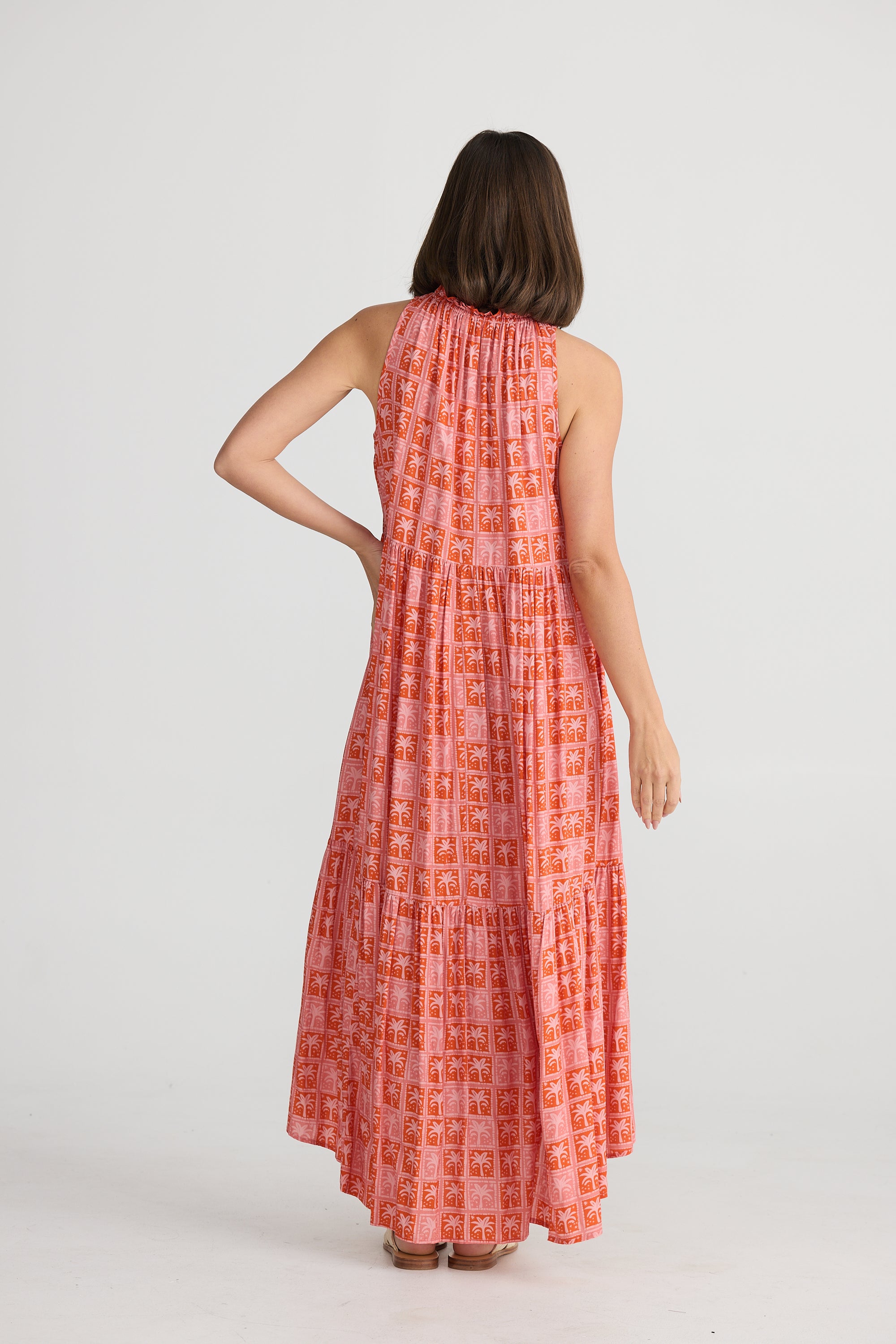 Back of women's Margot sleeveless pink and red palm tree print maxi dress  by Holiday Clothing.