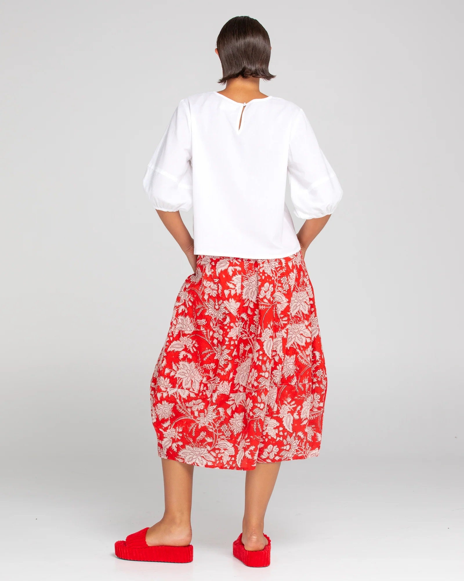 Back of ladies midi skirt in farrah red and white florals by Boom Shankar.