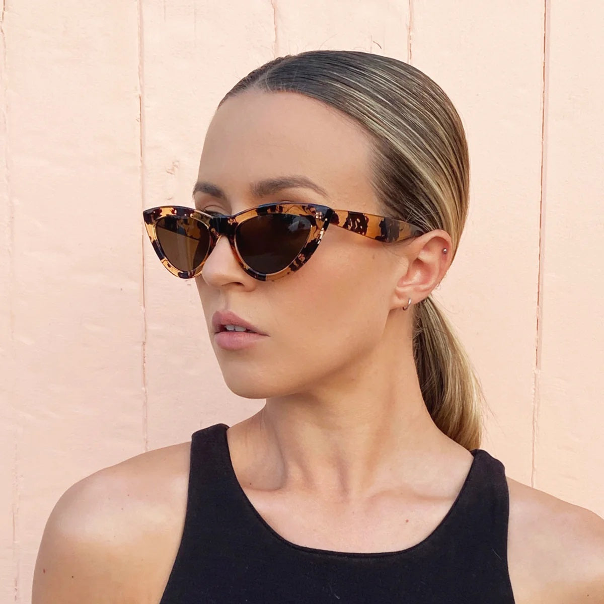 Reality Eyewear's Kiss Kiss Sunglasses in Honey Turtle and bright tortoiseshell colour.