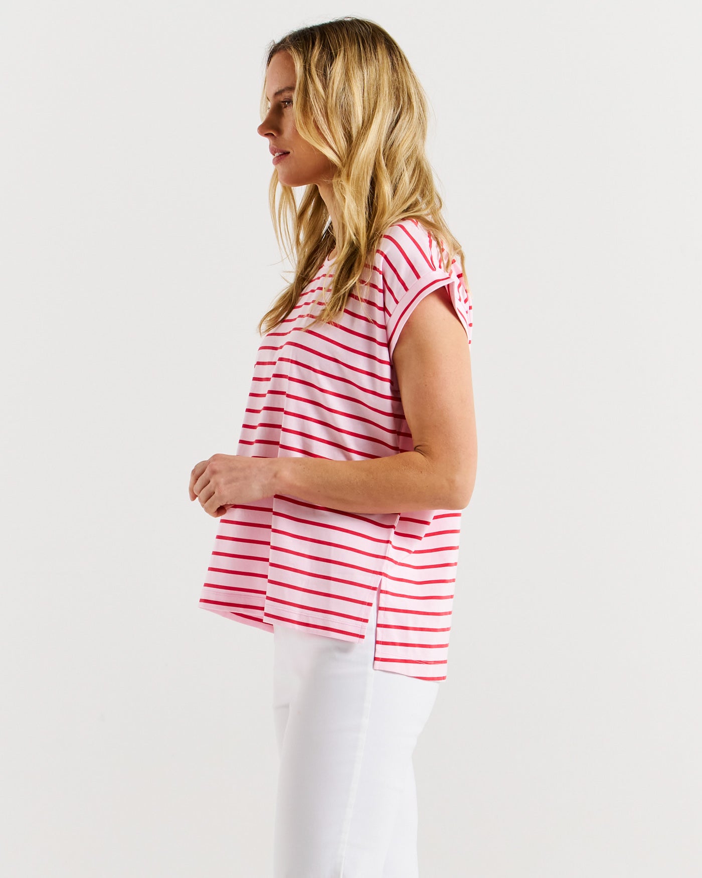 Side view of ladies Michaela pink tee with red stripes from Betty Basics.