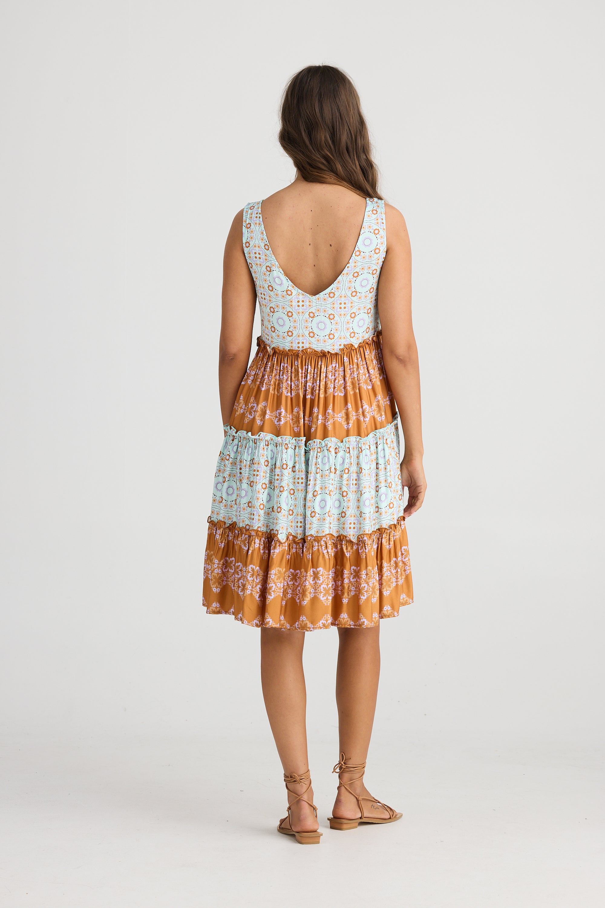 Lucky Charm Dress in Media Blue by Talisman, a tiered orange blue print in geometric shapes.