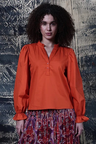 Maude Vivante&#39;s Rory Blouse Top in Burnt Orange with Long Sleeves, v-neck and standup collar.