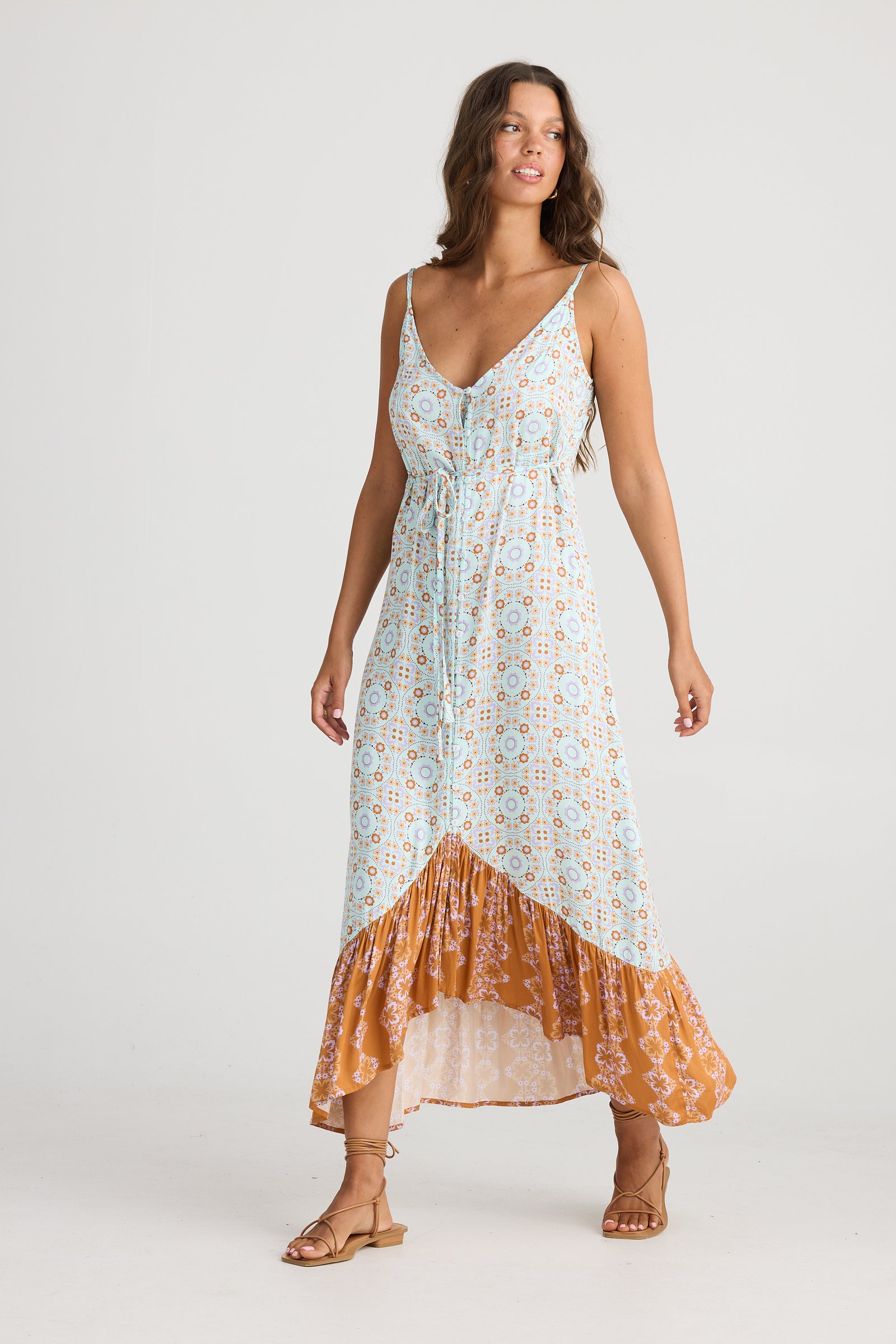 Talisman Oasis Dress in Medina Blue (brown / orange) geometric print with high low skirt hem.