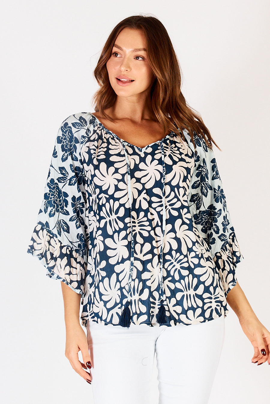 LulaLife Mia Top in Sea Green and White swirl and floral print with v-neck and long ruffle sleeves.