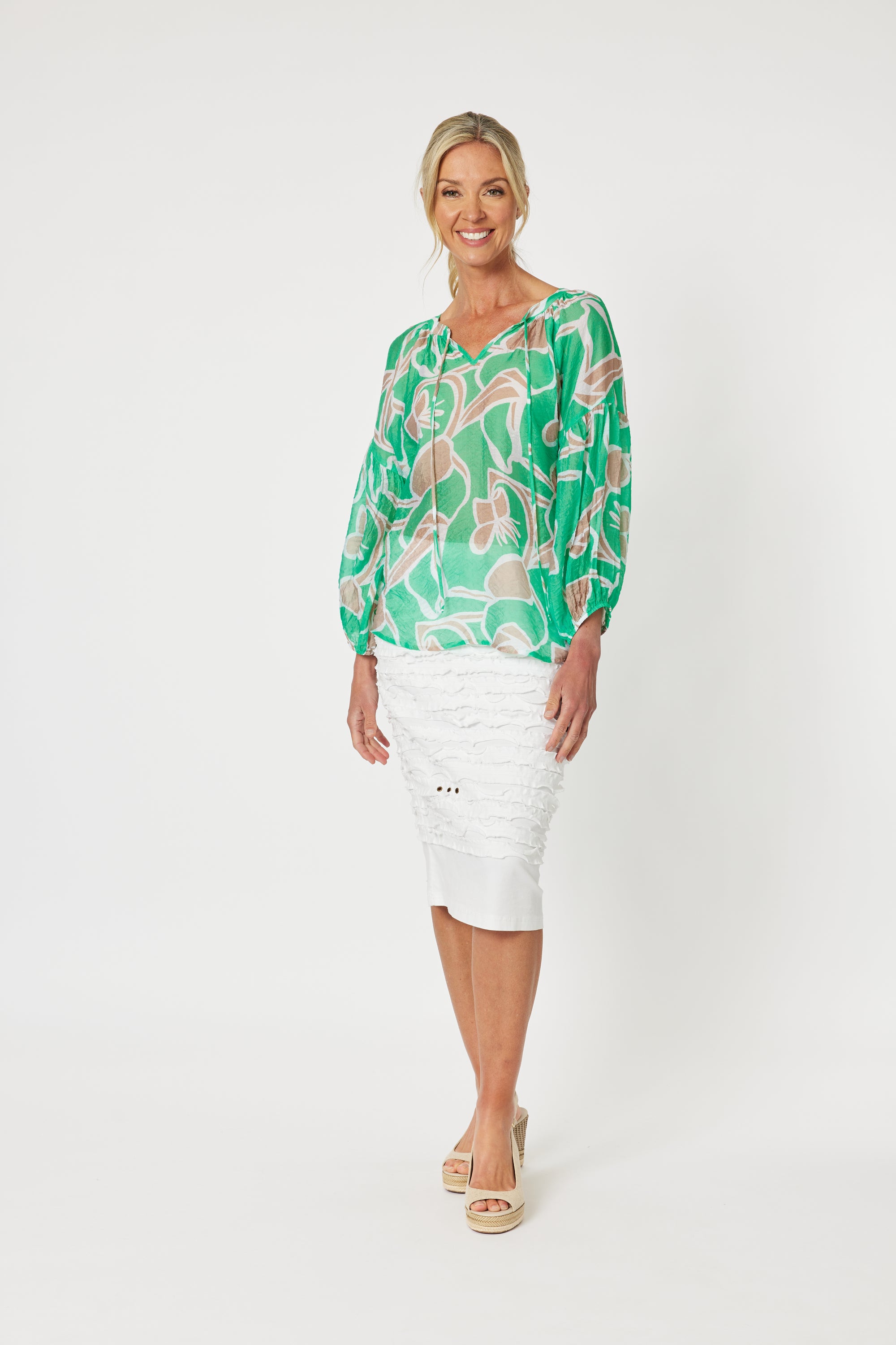 Women's Noosa Beach Top in Mint from Gordon Smith is lightweight has long sleeves with elasticated cuffs and v-neck with tassels. 