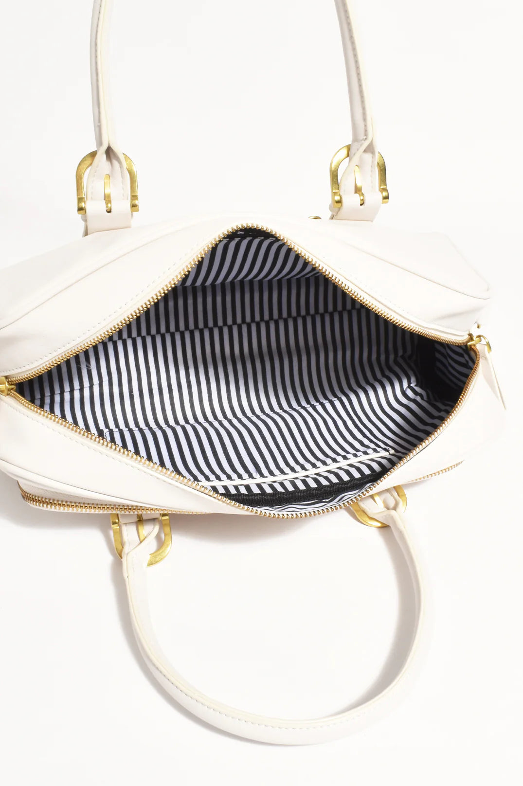 Inside of the Ottilie bowler handbag by Adorne with roomy inside and side compartments.