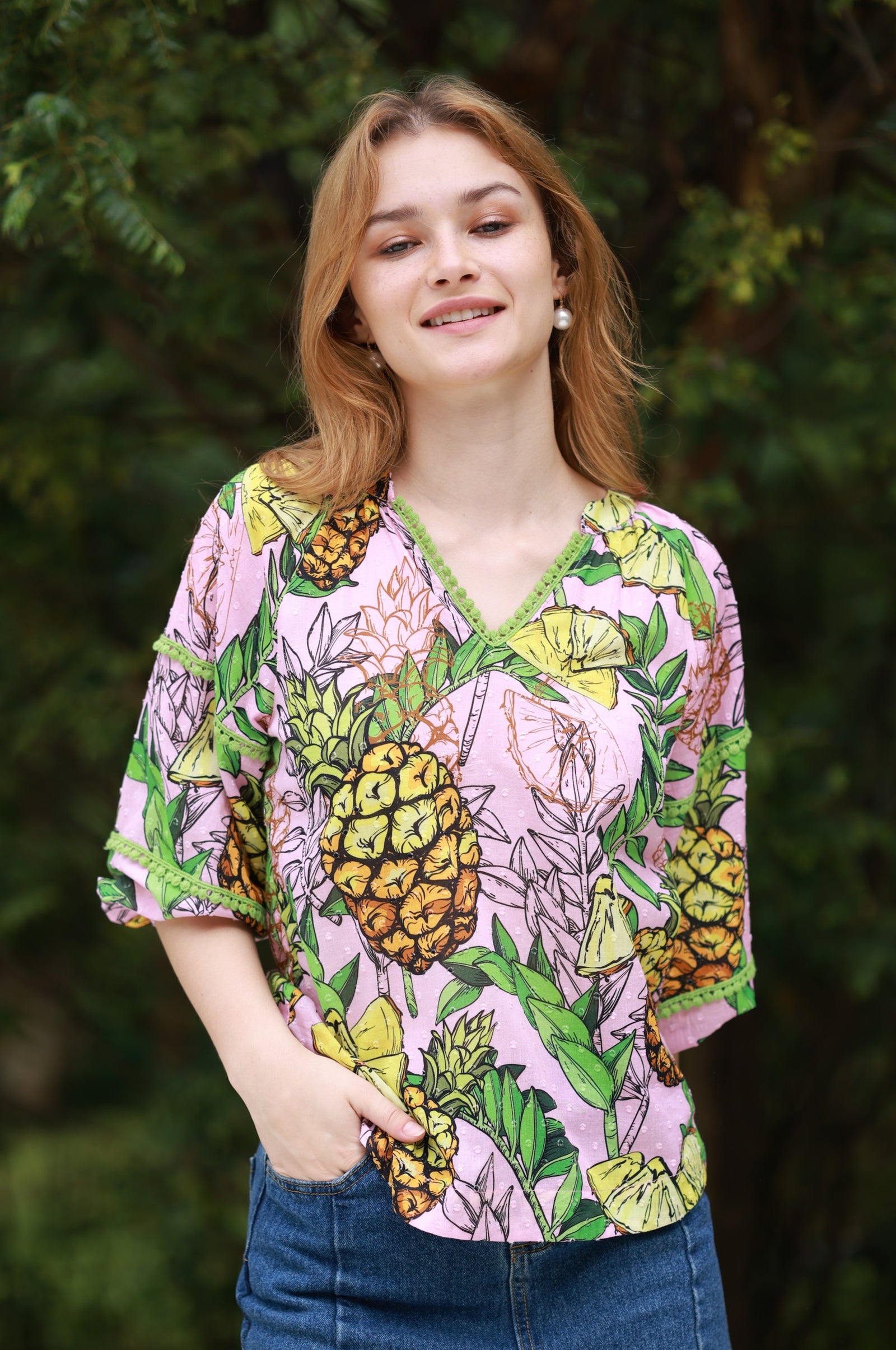 Model wearing Trixie Top with Pineapples print by Maude Vivante.