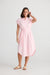 Ladies pink midi shirt dress with tie waist by Holiday Trading.