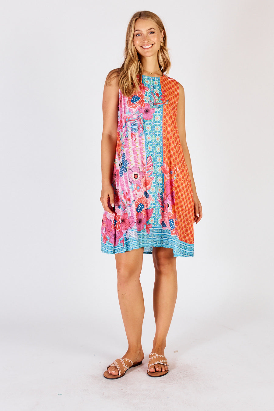 LulaLife&#39;s Miranda Swing Midi Dress in Sun, a pink, blue and orange striped floral dress with geometric pattern.