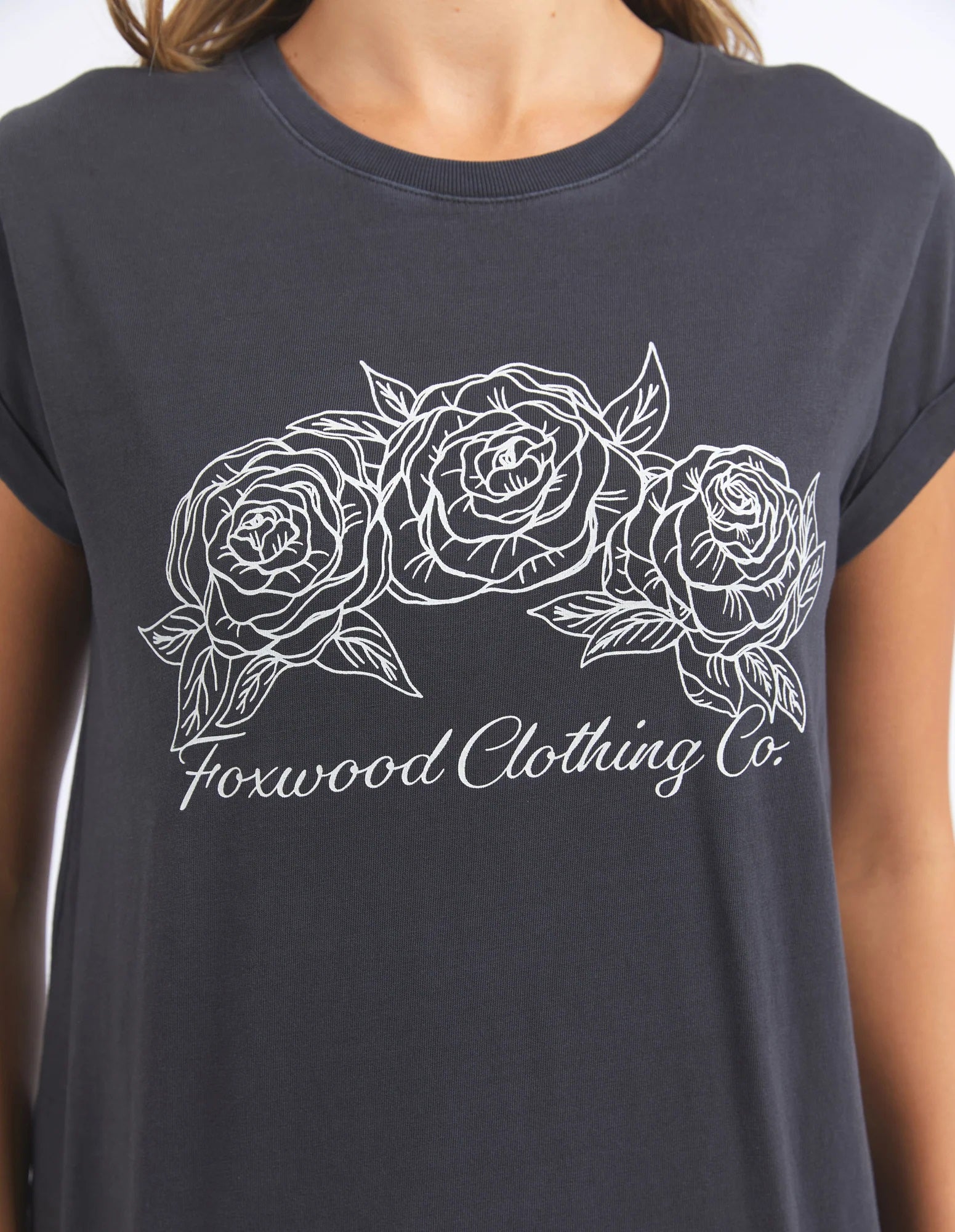 Close up of the Three Roses printed on the front with Foxwood Clothing Co written underneath on the Washed Black Eva Tee.