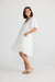 Side of knee length white v-neck tiered Lola midi dress by Holiday. 