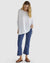 ladies drop shoulder, long sleeve, white knit top by Betty Basics.