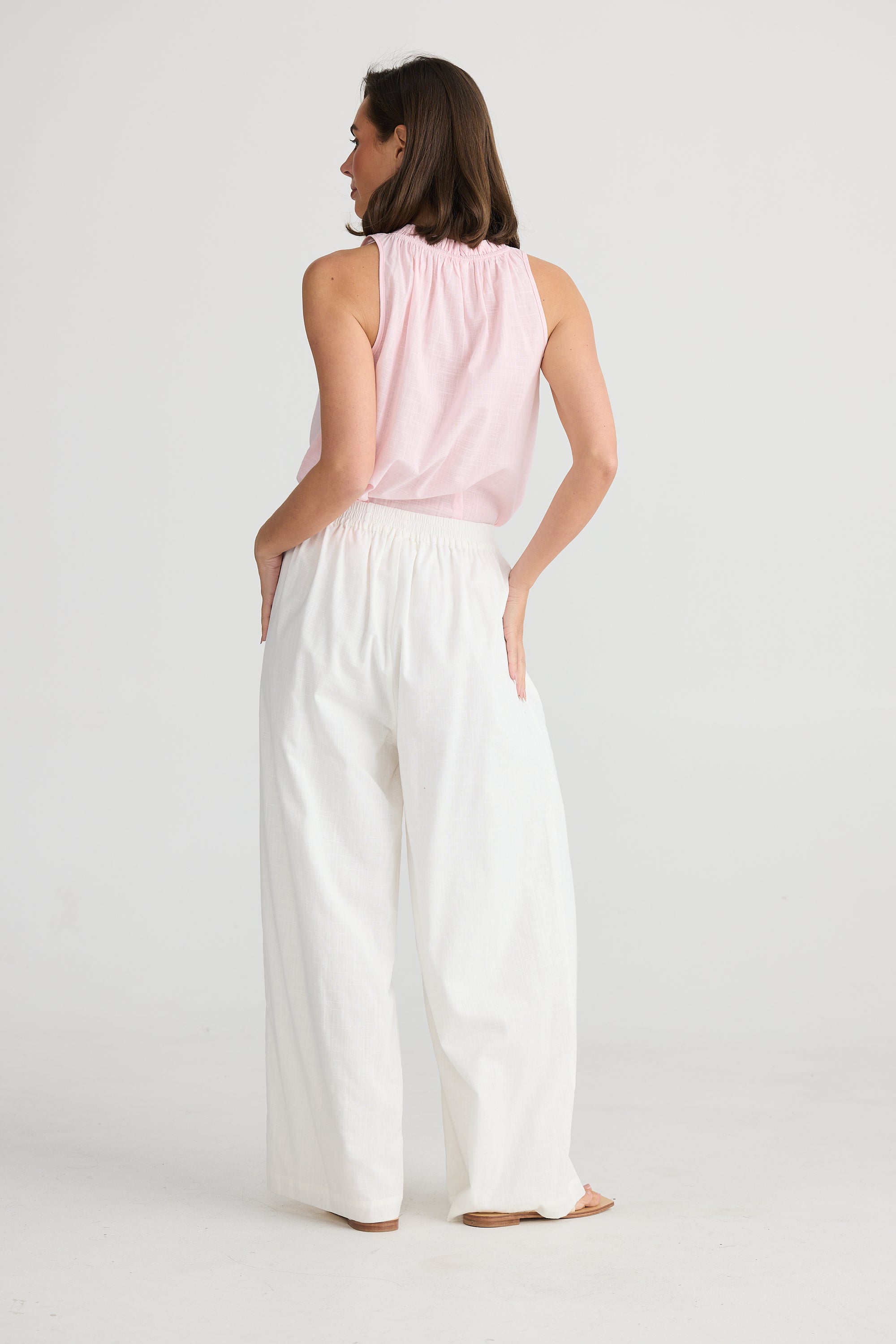 Back of elasticated waist playa pants in white by Holiday Trading.